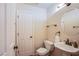 Cozy half bathroom featuring a pedestal sink and toilet at 8321 Gorsky Ave, Las Vegas, NV 89131