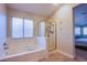Bright bathroom featuring separate bathtub and enclosed glass shower at 8321 Gorsky Ave, Las Vegas, NV 89131