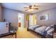 Bedroom with neutral walls, a ceiling fan, and two doors to other rooms at 8321 Gorsky Ave, Las Vegas, NV 89131