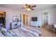 Bright bedroom featuring a make-up desk, carpet and access to a walk-in closet at 8321 Gorsky Ave, Las Vegas, NV 89131