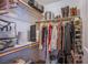 Functional closet with clothes on hangers and shelf space for shoes and accessories at 8321 Gorsky Ave, Las Vegas, NV 89131