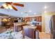 Spacious kitchen open to the dining area featuring granite counters and stainless steel appliances at 8321 Gorsky Ave, Las Vegas, NV 89131