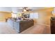 Open-concept living space showcases a large sectional, adjacent dining area, and neutral color palette at 8321 Gorsky Ave, Las Vegas, NV 89131