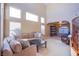 Open concept living room with lots of natural light, high ceilings, and comfortable seating at 8321 Gorsky Ave, Las Vegas, NV 89131