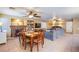 Open-concept living room with a fireplace, dining area, and comfortable seating at 8321 Gorsky Ave, Las Vegas, NV 89131