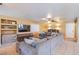 Cozy living room with large sectional sofa, built-in shelving, and a media center at 8321 Gorsky Ave, Las Vegas, NV 89131