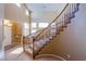 Elegant staircase with wooden railings and carpeted steps leading to the upper level at 8321 Gorsky Ave, Las Vegas, NV 89131