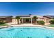 Inviting backyard featuring a pool, pergola-covered patio, and well-maintained landscaping at 8404 Dripping Rock Ct, Las Vegas, NV 89131