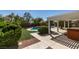 Beautiful backyard with a private pool, hot tub, pergola and lush landscaping at 8404 Dripping Rock Ct, Las Vegas, NV 89131