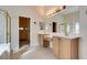 Elegant bathroom boasting dual vanities, tile floors, and a separate shower at 8404 Dripping Rock Ct, Las Vegas, NV 89131
