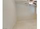 Neutral bedroom with light walls, carpet flooring, and ceiling fan at 8404 Dripping Rock Ct, Las Vegas, NV 89131