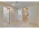 Spacious bedroom with attached bathroom, white doors and carpeted floor at 8404 Dripping Rock Ct, Las Vegas, NV 89131