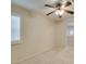 Neutral bedroom with light walls, carpet flooring, ceiling fan, and shutter blinds at 8404 Dripping Rock Ct, Las Vegas, NV 89131