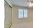 Carpeted bedroom includes mirrored closet doors and plantation shutters at 8404 Dripping Rock Ct, Las Vegas, NV 89131