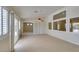 Dining room with tiled floors and plantation shutters, with outdoor access at 8404 Dripping Rock Ct, Las Vegas, NV 89131
