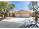 Attractive single-story home featuring a spacious driveway and a two-car garage at 8404 Dripping Rock Ct, Las Vegas, NV 89131