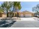 Charming single-story home with a well-manicured front yard and a two-car garage at 8404 Dripping Rock Ct, Las Vegas, NV 89131