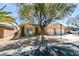 Charming single-story home with a well-manicured front yard and a two-car garage at 8404 Dripping Rock Ct, Las Vegas, NV 89131