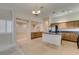 Charming kitchen featuring wood cabinets, granite countertops, and an island at 8404 Dripping Rock Ct, Las Vegas, NV 89131