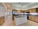 Modern kitchen featuring a central island, stainless steel appliances, and wood cabinetry at 8404 Dripping Rock Ct, Las Vegas, NV 89131