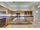 Spacious kitchen island with a sink and granite countertops, stainless appliances, and wooden cabinets at 8404 Dripping Rock Ct, Las Vegas, NV 89131