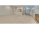 Large living room with tiled entry, neutral carpet, and open access to the entryway at 8404 Dripping Rock Ct, Las Vegas, NV 89131