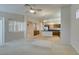 Comfortable living room featuring a ceiling fan, plantation shutters, and an open floor plan at 8404 Dripping Rock Ct, Las Vegas, NV 89131