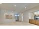 Bright living room featuring neutral walls, recessed lighting, and an open floor plan at 8404 Dripping Rock Ct, Las Vegas, NV 89131