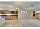 Open concept living room with built-in shelving and kitchen with granite counters and wine rack at 8404 Dripping Rock Ct, Las Vegas, NV 89131