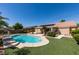 A sparkling private pool offers a refreshing escape in this home's backyard oasis at 8404 Dripping Rock Ct, Las Vegas, NV 89131