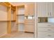 Spacious walk-in closet featuring custom shelving and ample storage space at 8404 Dripping Rock Ct, Las Vegas, NV 89131