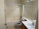 Bathroom featuring a vanity sink, mirror, toilet, and shower-tub combination at 8616 Hidden Pines Ave, Las Vegas, NV 89143
