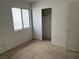 Bedroom with a window and closet that offers lots of space for storage at 8616 Hidden Pines Ave, Las Vegas, NV 89143