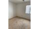 Cozy bedroom featuring a window that allows natural light into the space at 8616 Hidden Pines Ave, Las Vegas, NV 89143