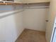 Walk-in closet with rod and shelves for ample storage space at 8616 Hidden Pines Ave, Las Vegas, NV 89143