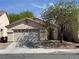 Charming single-story home with a two-car garage and desert landscaping at 8616 Hidden Pines Ave, Las Vegas, NV 89143