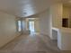 Spacious living room with carpet flooring, neutral paint, and a view of the front yard at 8616 Hidden Pines Ave, Las Vegas, NV 89143
