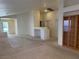 Bright living room with carpet, neutral walls, and open access to other rooms at 8616 Hidden Pines Ave, Las Vegas, NV 89143