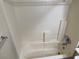 Clean white-tiled shower and tub, providing a relaxing bathing experience at 8616 Hidden Pines Ave, Las Vegas, NV 89143