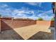 Backyard with brick fence and gravel ground at 8626 Anderson Dale Ave, Las Vegas, NV 89178