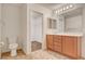 Bathroom with wood vanity, tile floors and walk-in closet at 8626 Anderson Dale Ave, Las Vegas, NV 89178