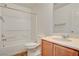 Bathroom featuring a shower/tub combo, large mirror, vanity and tile flooring at 8626 Anderson Dale Ave, Las Vegas, NV 89178