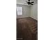 Bright bedroom with neutral walls, carpet, ceiling fan, and lots of natural light from the window at 8626 Anderson Dale Ave, Las Vegas, NV 89178