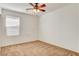 Bedroom featuring carpet flooring, neutral paint, a ceiling fan and window at 8626 Anderson Dale Ave, Las Vegas, NV 89178