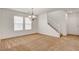 Bright, open dining room features a chandelier and staircase at 8626 Anderson Dale Ave, Las Vegas, NV 89178