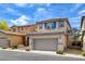 Charming two-story home with a two-car garage, desert landscaping, and a tile roof at 8626 Anderson Dale Ave, Las Vegas, NV 89178