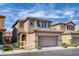 Charming two-story home with a two-car garage, desert landscaping, and a tile roof at 8626 Anderson Dale Ave, Las Vegas, NV 89178