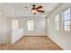 Neutral carpet in the loft area is enhanced by a ceiling fan and lots of natural light at 8626 Anderson Dale Ave, Las Vegas, NV 89178