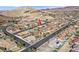 Aerial view showcases the home's location and the community with city and mountain views at 904 Rhyolite Ter, Henderson, NV 89011