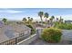 Landscaped backyard with desert plants, palms, and city views from the elevated lot at 904 Rhyolite Ter, Henderson, NV 89011